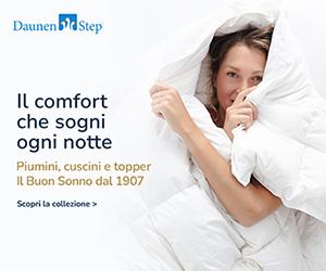 A woman with long hair wrapped in a white comforter, promoting a bedding collection by DaunenStep.