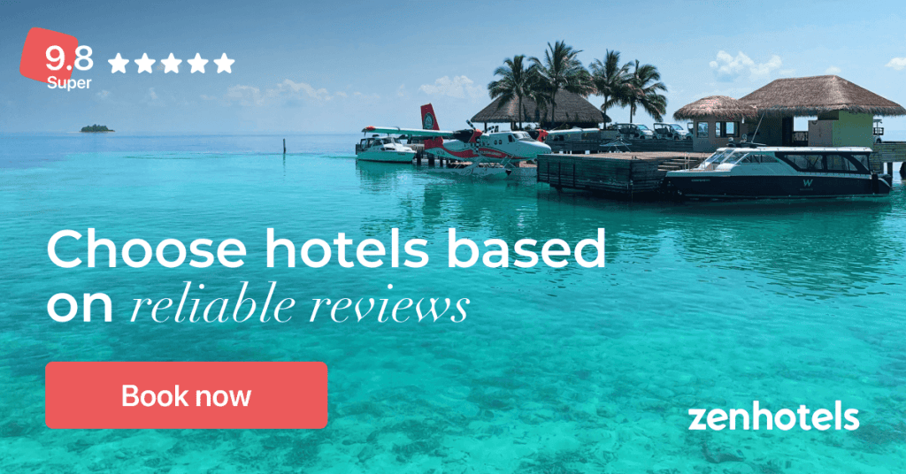 A scenic view of a marina with several boats docked, surrounded by clear turquoise waters and tropical palm trees. The image features a promotional text urging viewers to choose hotels based on reliable reviews.
